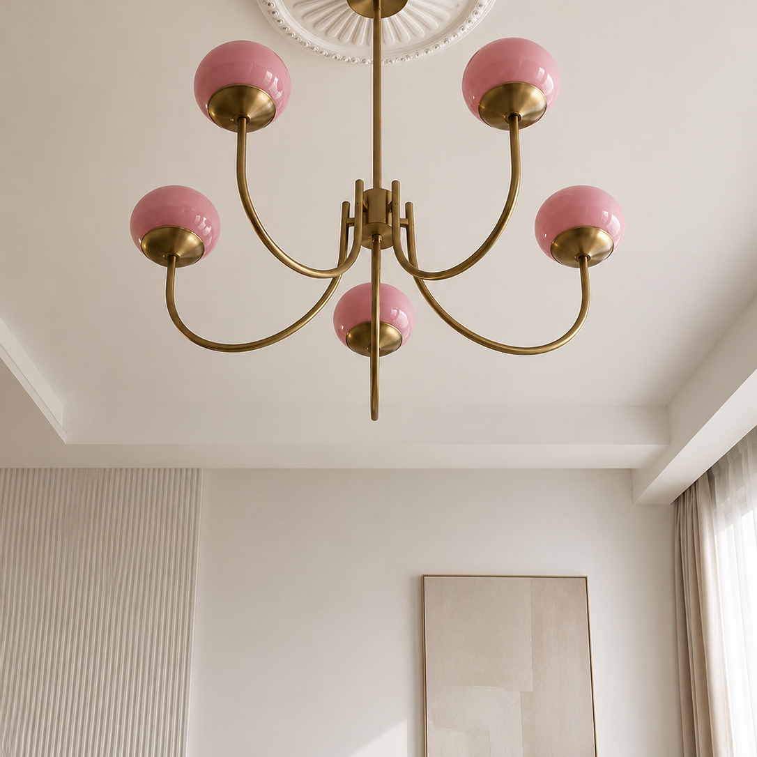 Chandelier with pink glass shades on a white ceiling