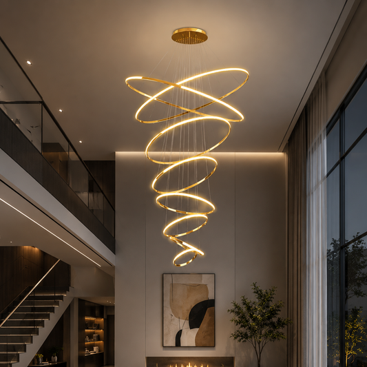 Modern living room with a spiral chandelier, sectional sofa, and decorative elements.