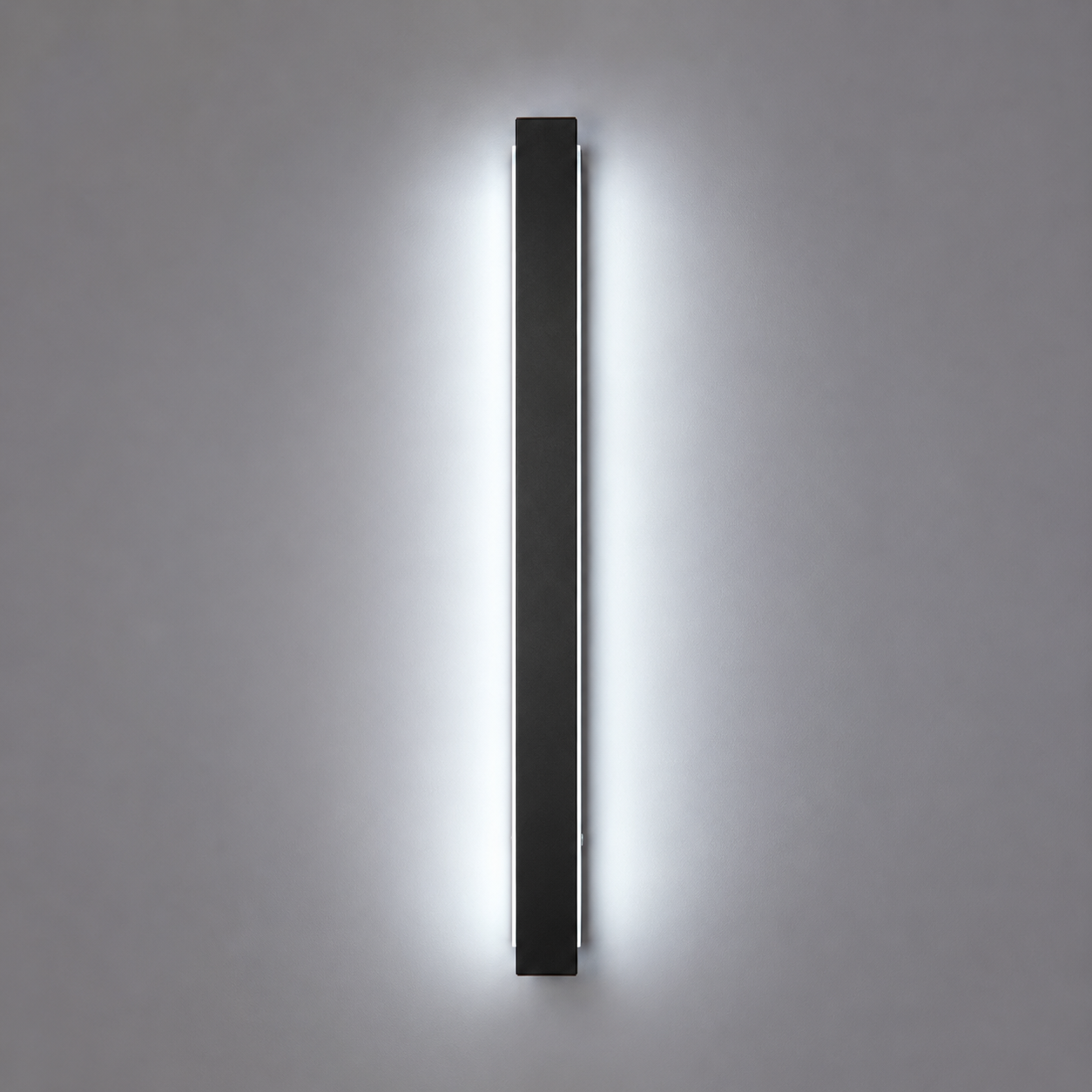 Modern wall-mounted light fixture on a gray background